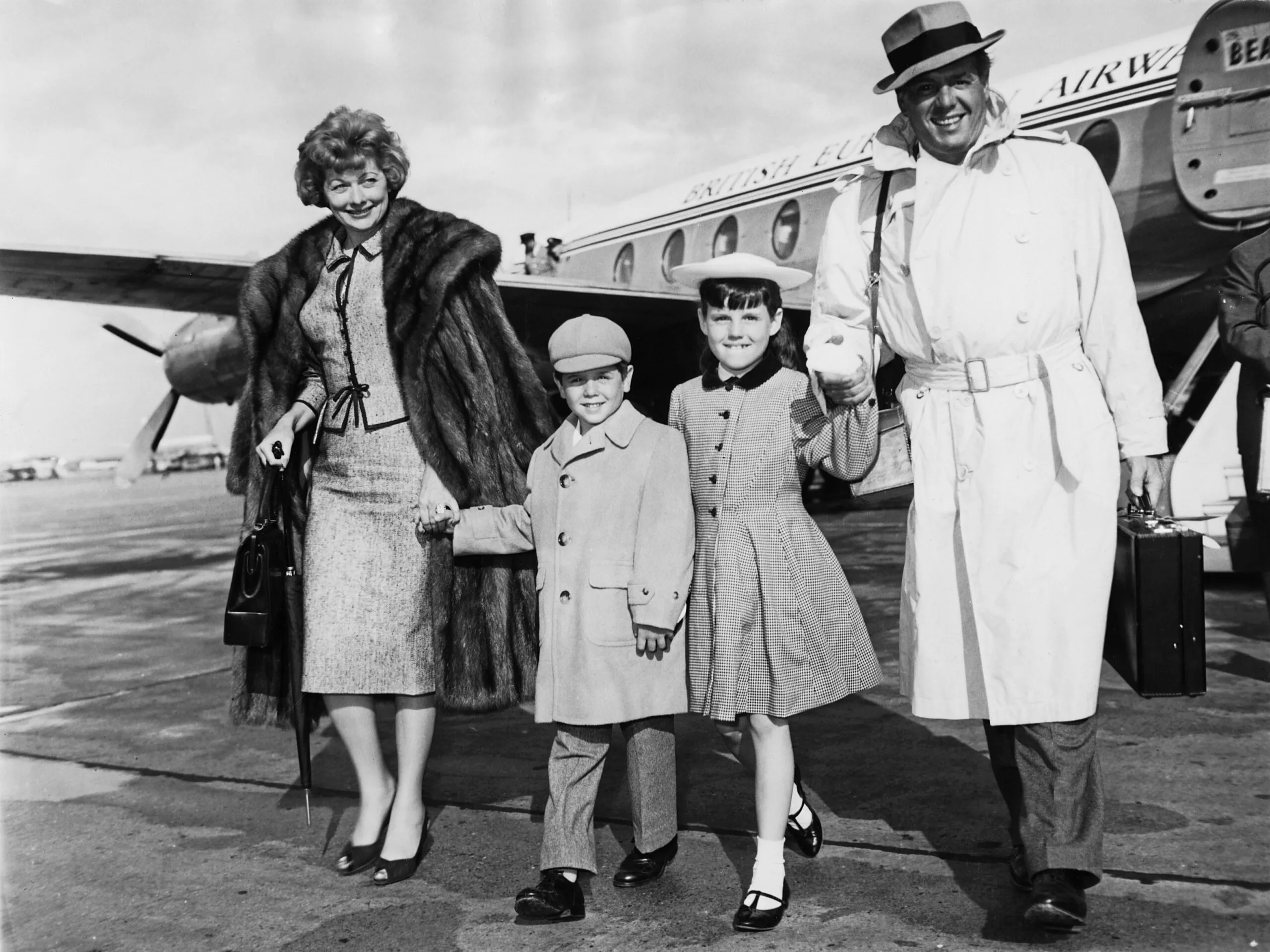 American actress Lucille Ball and her husband Desi Arnaz arrive at London Airport with their children Lucie and Desi Jr., 10th June 1959. They have just arrived from Naples for a three-day visit. (Photo by J. Wilds/Keystone/Hulton Archive/Getty Images)