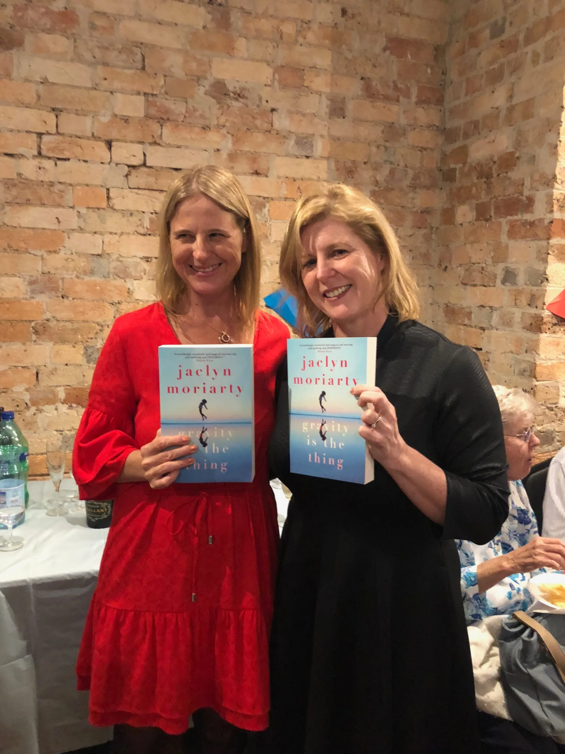 Sisters Jaclyn and Liane Moriarty celebrating the launch of Jaclyn's book Gravity Is The Thing. Photo supplied and used with permission.