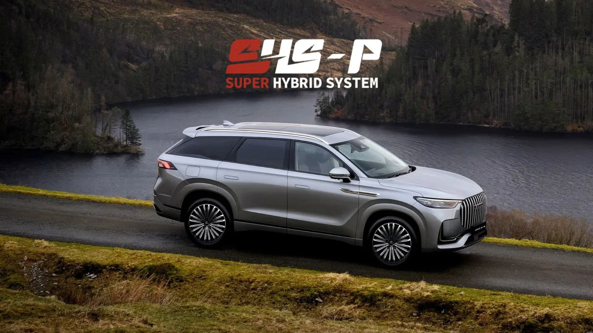 Silver JAECOO plug-in hybrid SUV Australia parked on a scenic lakeside road.