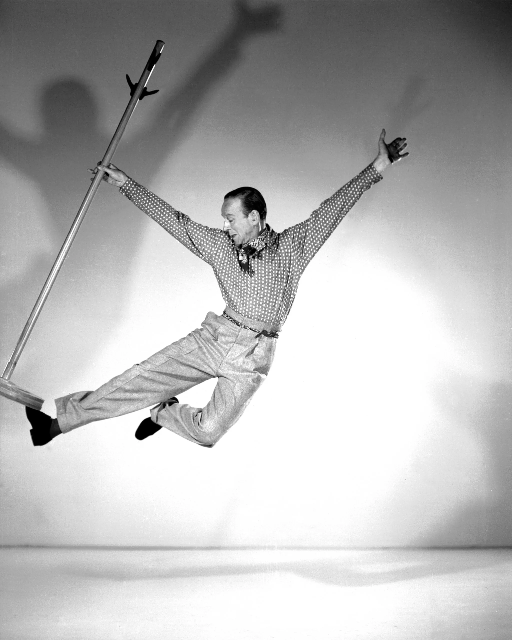 11th October 1950: Hollywood star Fred Astaire (1899 - 1987) performs a dramatic dance step with a hat stand for a partner in the film 'Royal Wedding', directed by Stanley Donen. (Photo by Silver Screen Collection/Archive Photos/Getty Images)