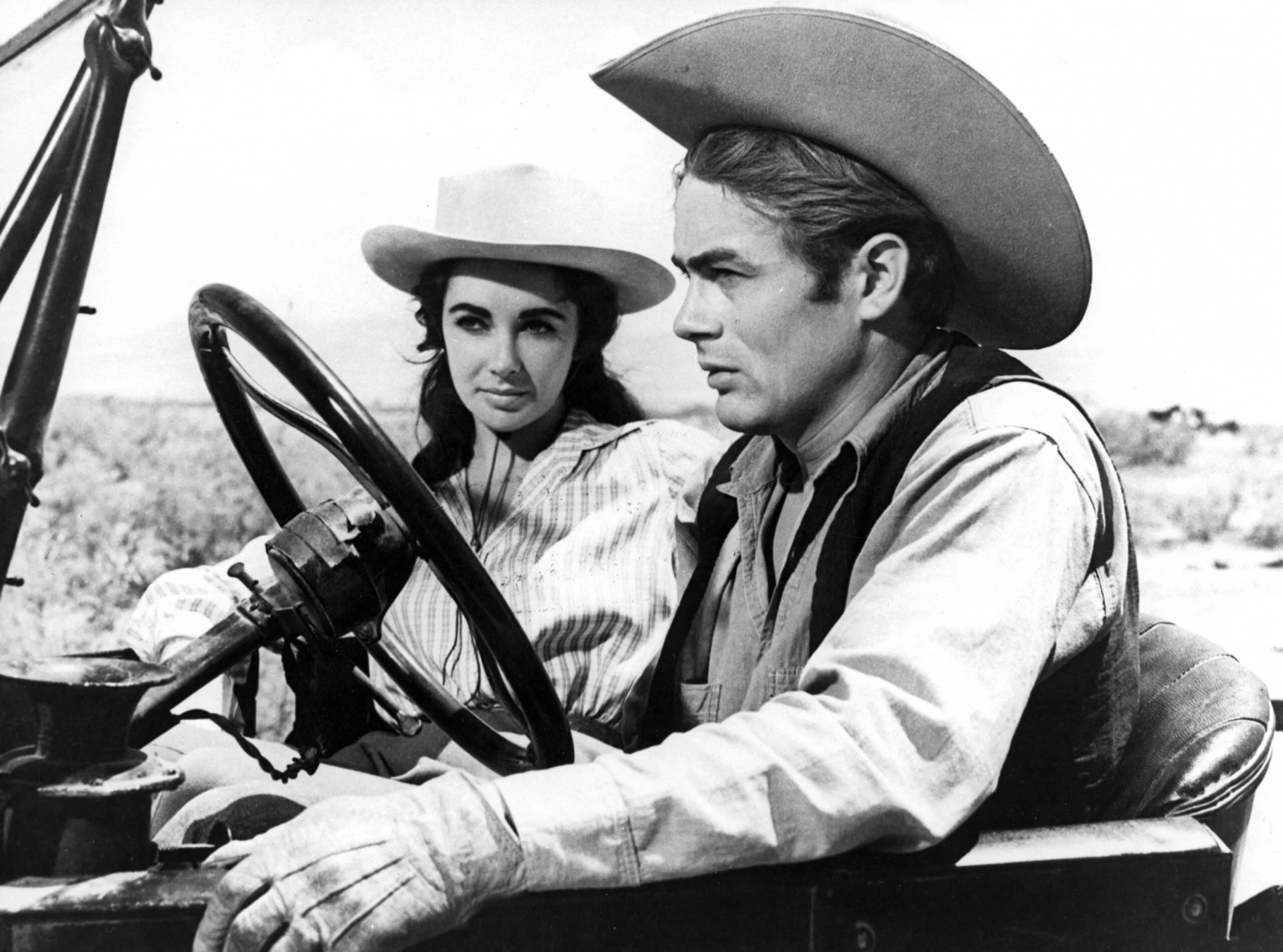 James Dean (R) and Elizabeth Taylor on the film set of "Giant" directed by George Stevens in 1956. (Photo by API/GAMMA/Gamma-Rapho via Getty Images)