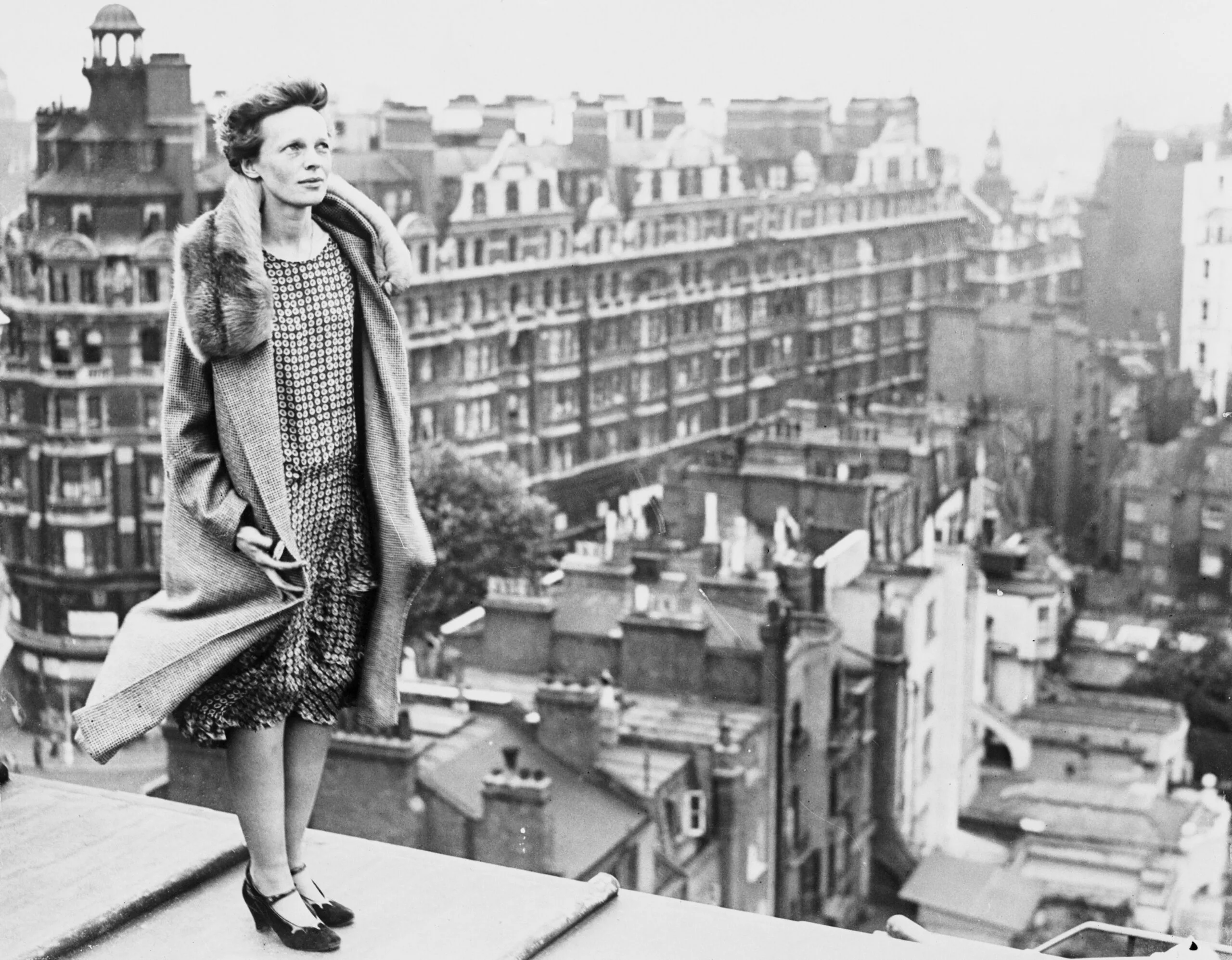 (Original Caption) The above photo shows Miss Amelia Earhart, copilot of the transatlantic plane, Friendship, atop the roof of the Hyde Park Hotel in London, getting a view.