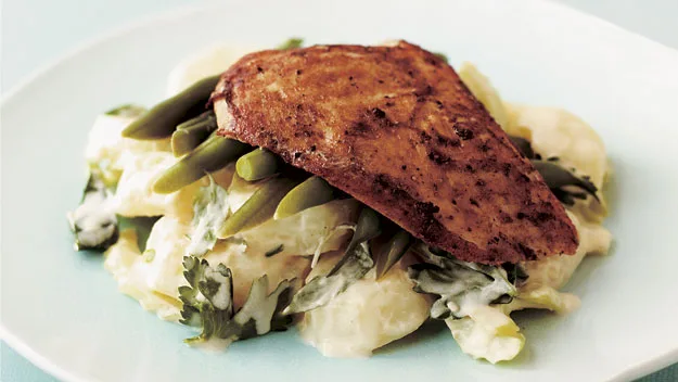 Char-grilled chicken on warm potato and bean salad