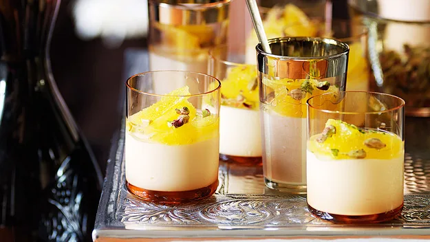 Honey and cardamom panna cotta with oranges