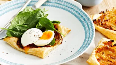 Soft-boiled eggs on onion tartlets