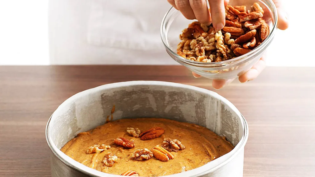 Sprinkle sticky date cake with nuts