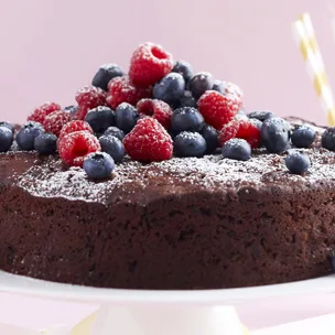 chocolate and zucchini cake with berries on top