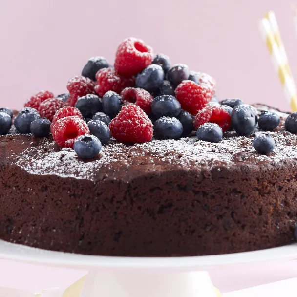 chocolate and zucchini cake with berries on top