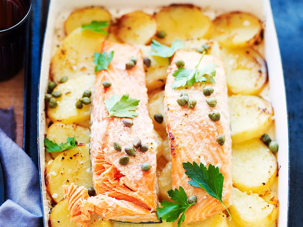 Lemon and garlic roast salmon on potatoes