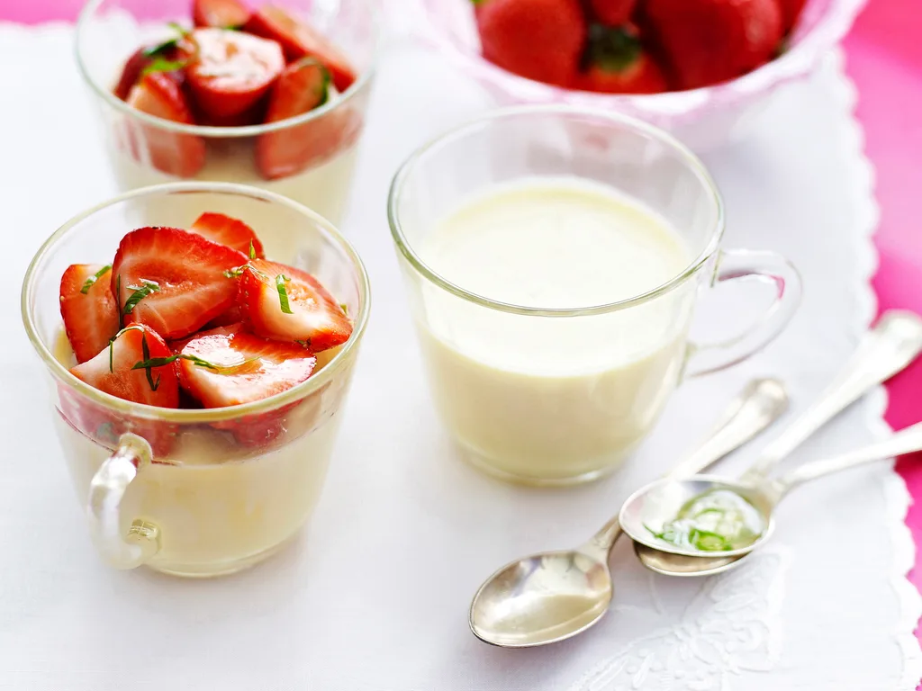 Panna cotta with strawberries with lemon basil syrup