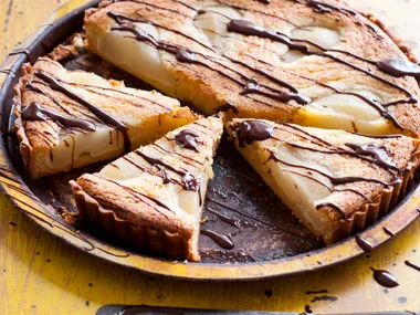 Poached pear tart with warm chocolate sauce