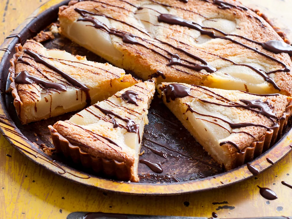 Poached pear tart with warm chocolate sauce