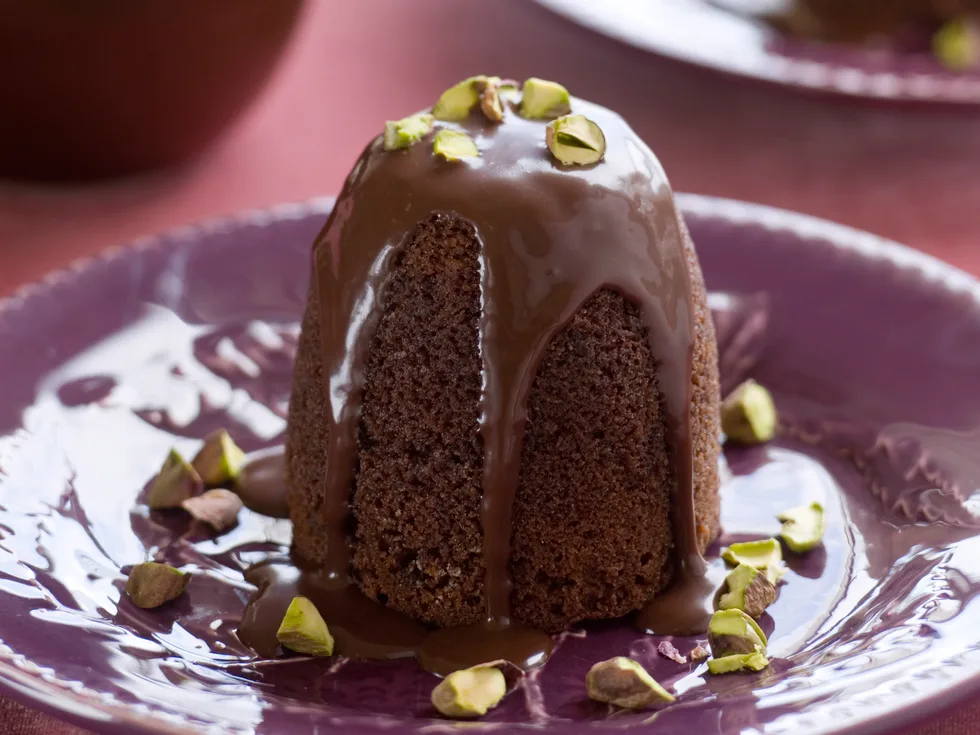 Chocolate pistachio puddings with chocolate fudge sauce