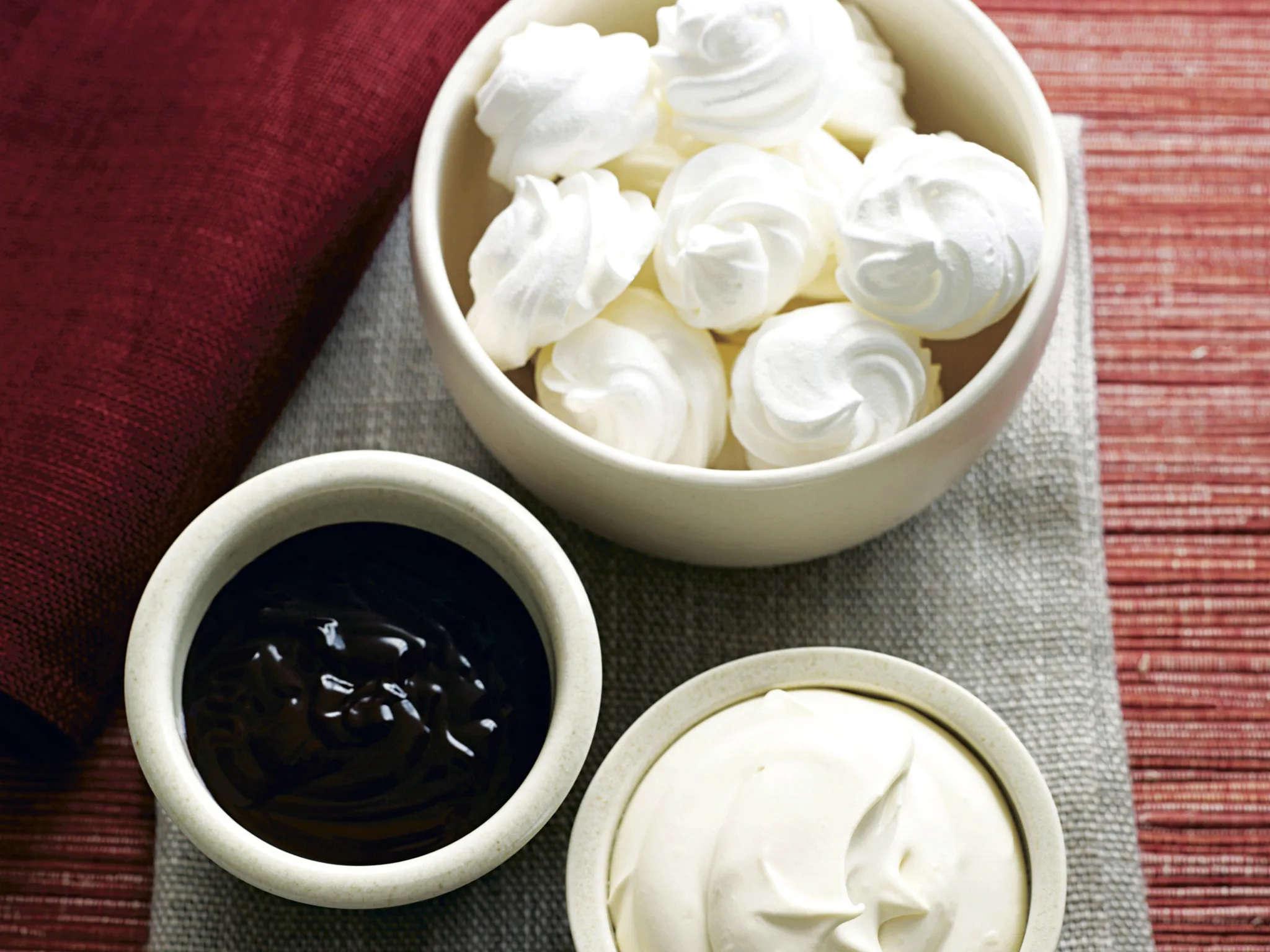 Meringues with Liqueur Cream and Chocolate Sauce