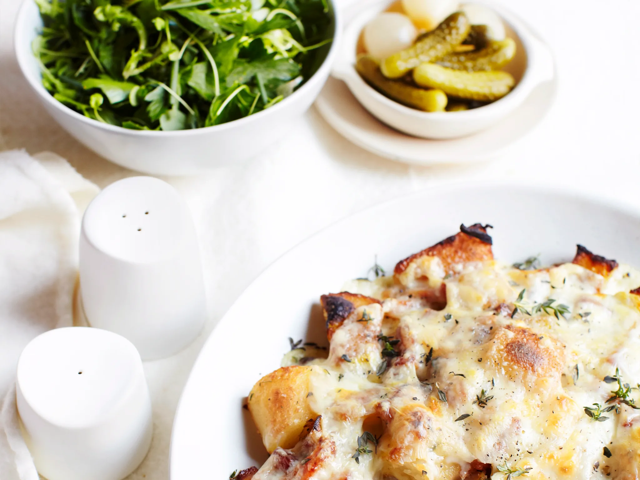 Raclette with smoked bacon and fine herb salad