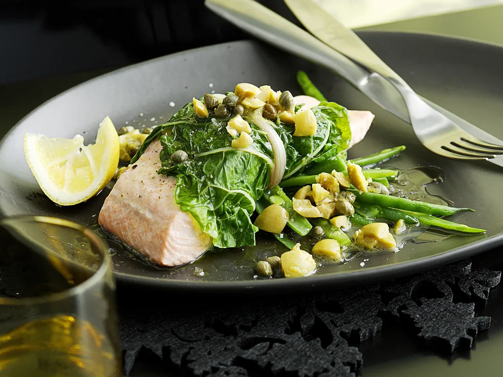 steamed salmon in silverbeet with lemon and olive sauce