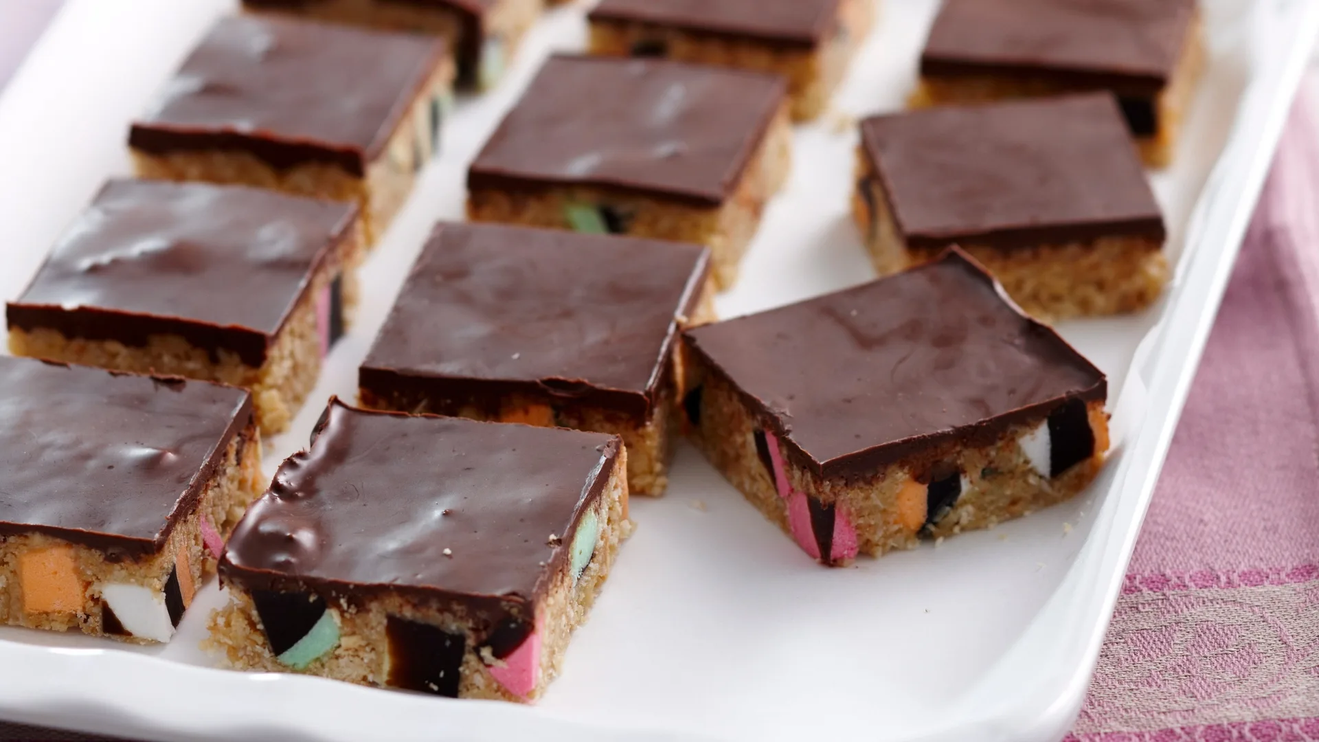 liquorice allsorts slice pieces on a white platter
