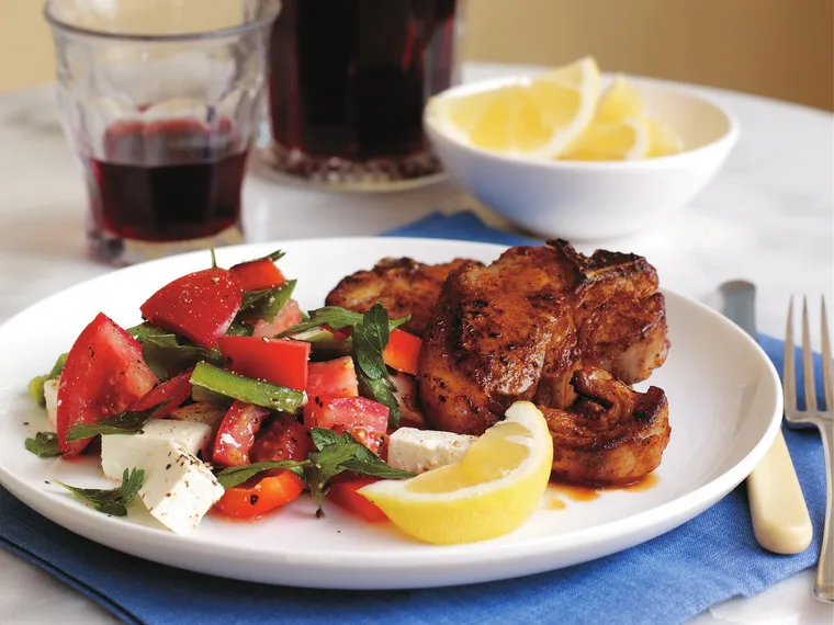paprika-dusted loin chops served with greek salad