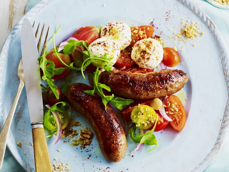lamb sausages with labne, dukkah and tomato salad