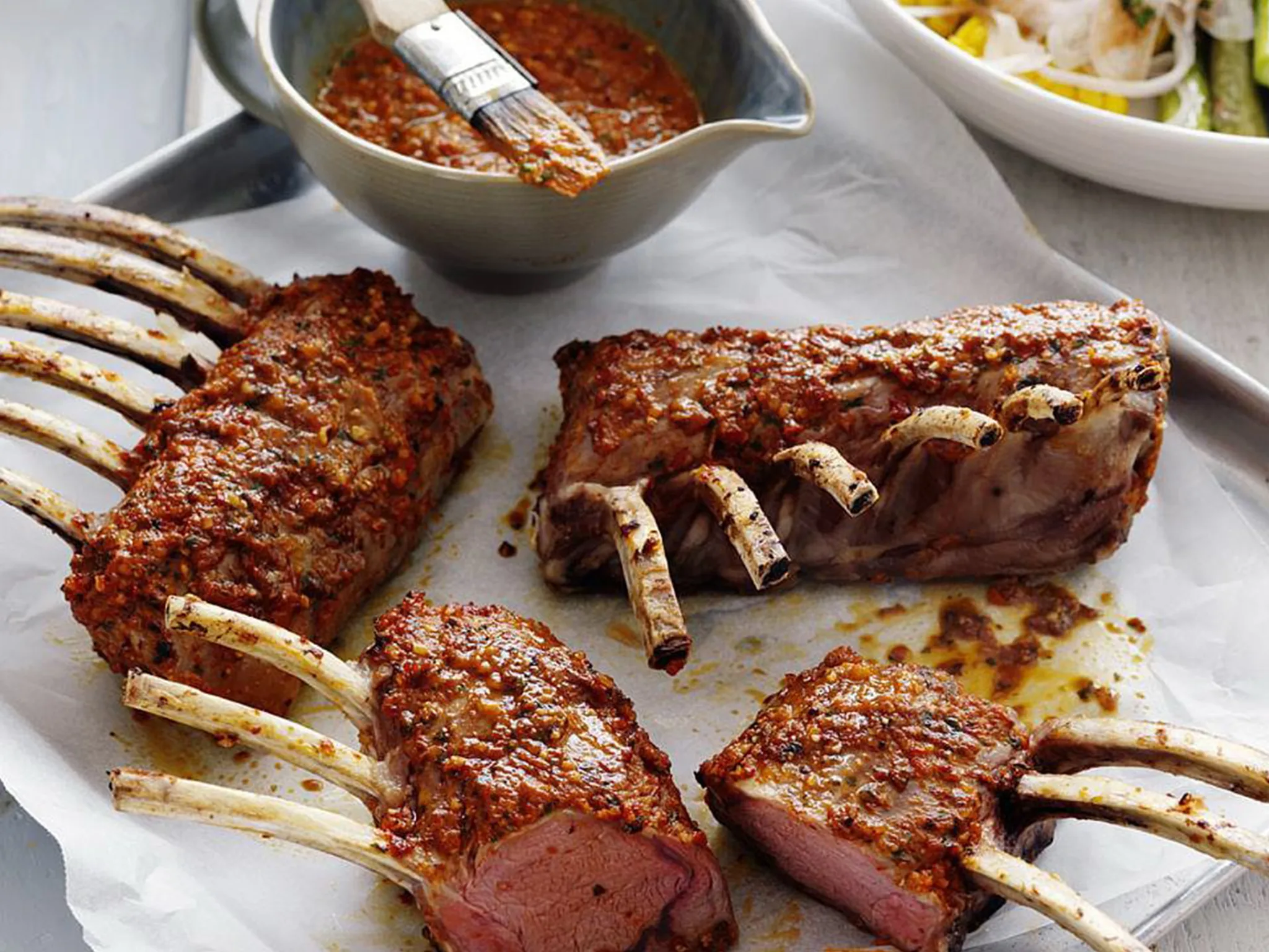 lamb racks with capsicum pesto, asparagus & corn
