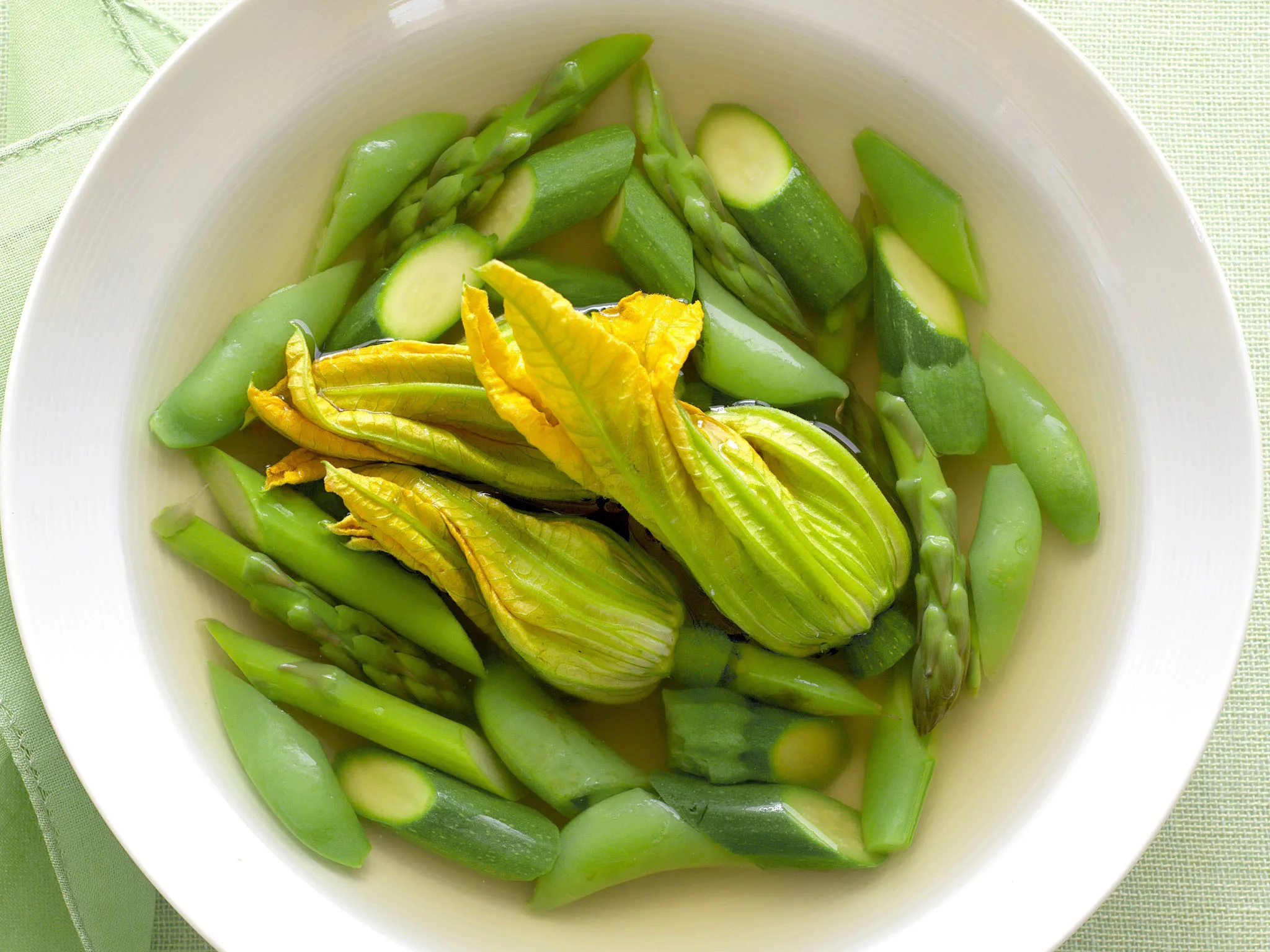 SPRING VEGETABLE BROTH WITH CHEESE-FILLED ZUCCHINI FLOWERS