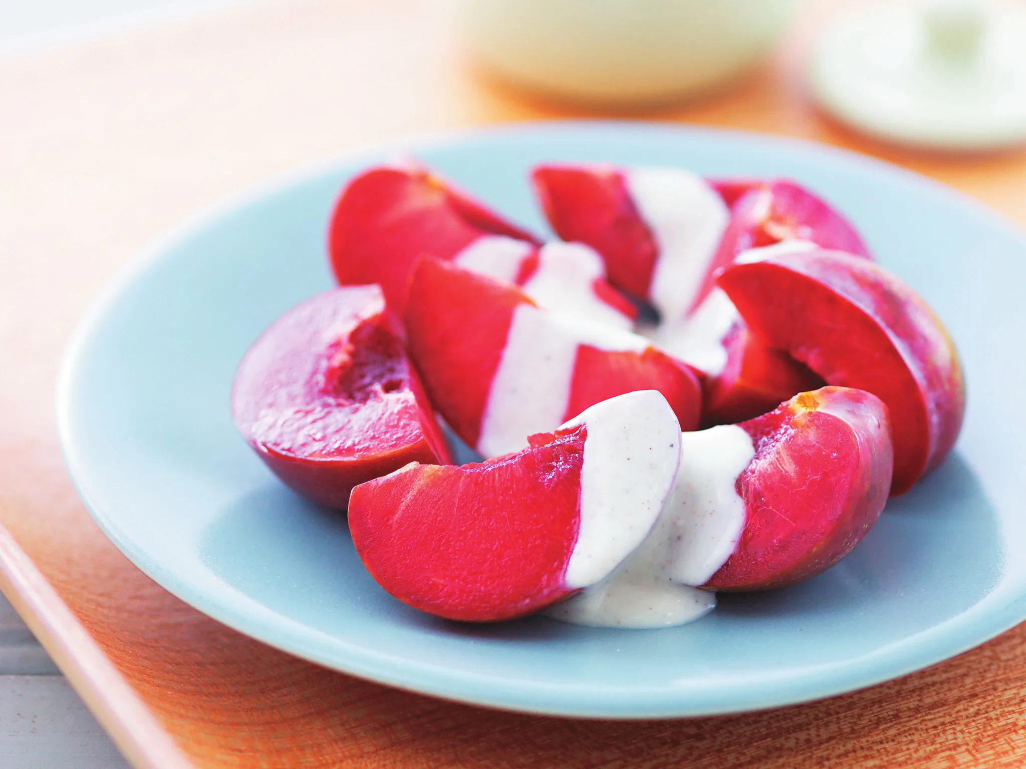 Blood plums with honey and cardamom yogurt