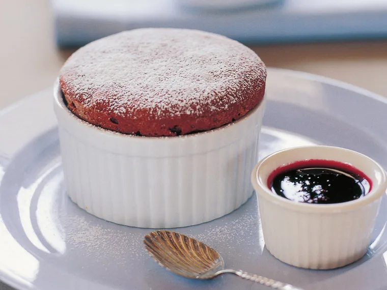 Chocolate souffl&eacute; with raspberry coulis