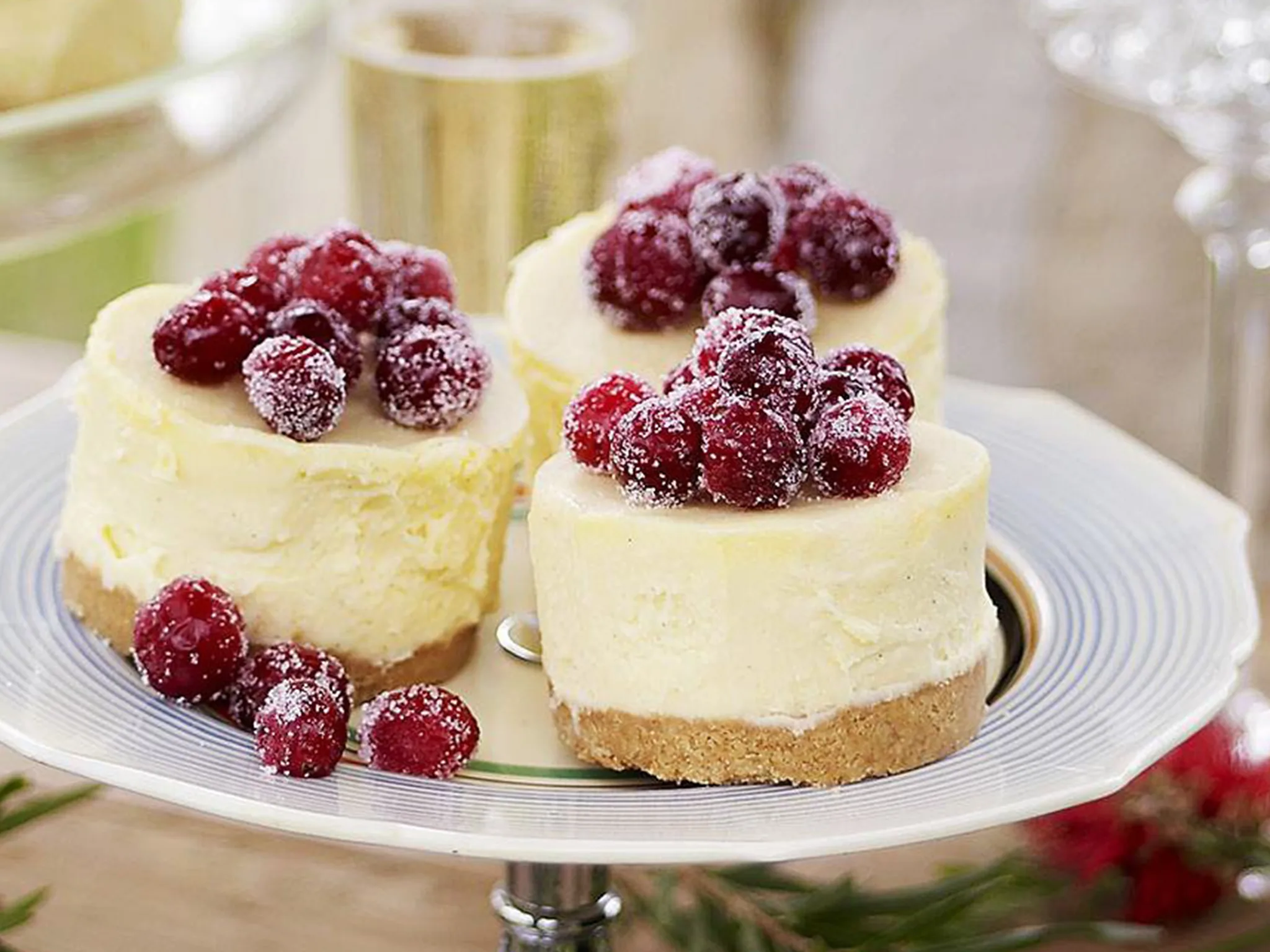 white chocolate cheesecakes with frosted cranberries