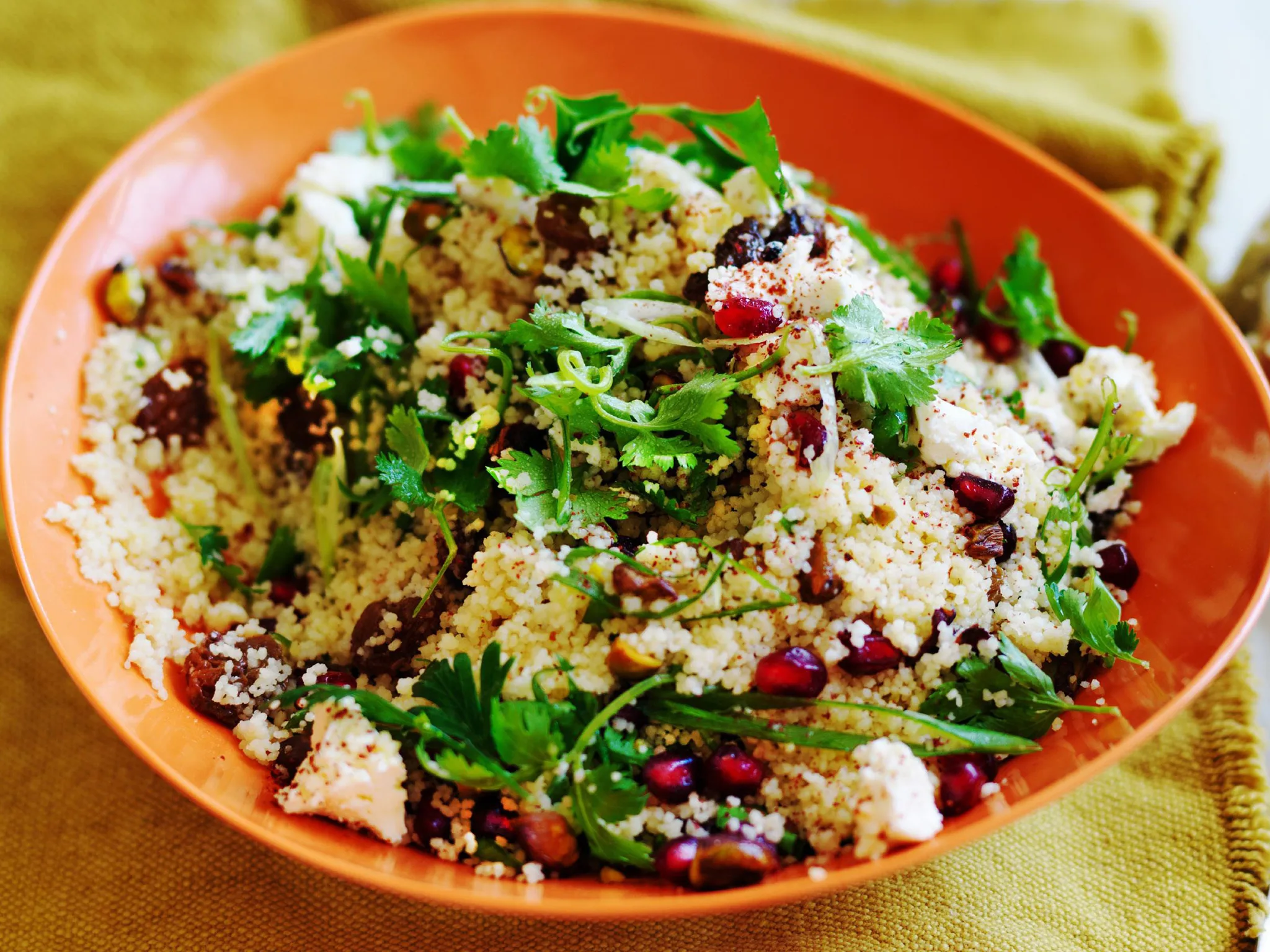 Couscous with herbs and pomegranate in a bowl