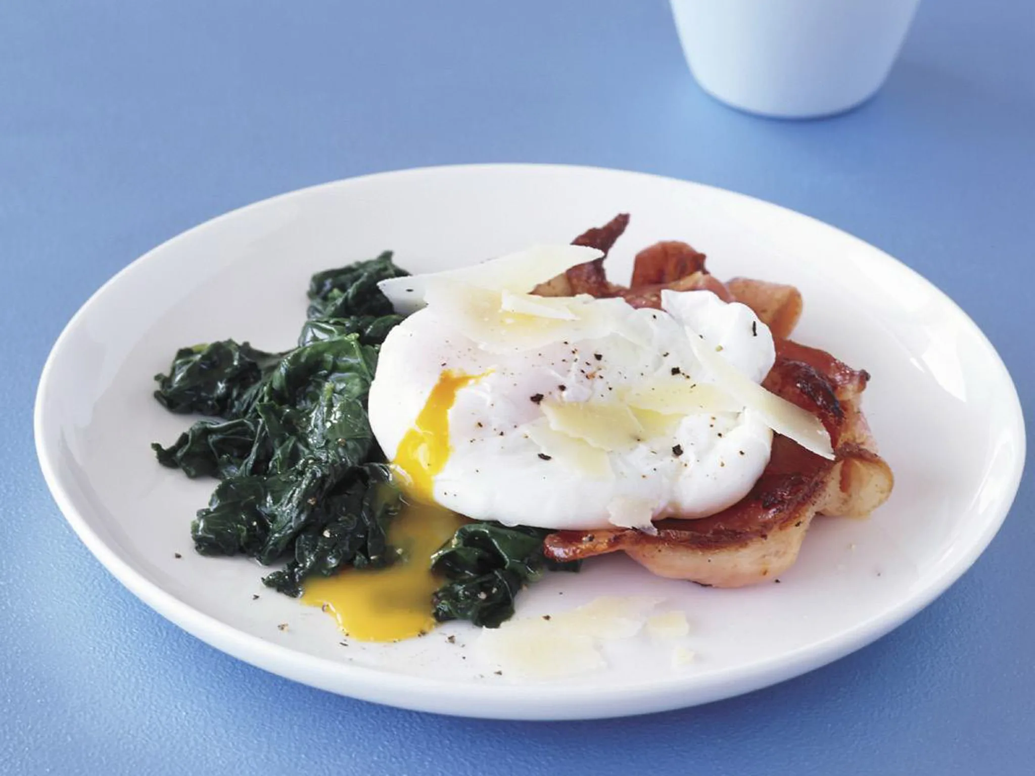 poached eggs and bacon with spinach & cheese