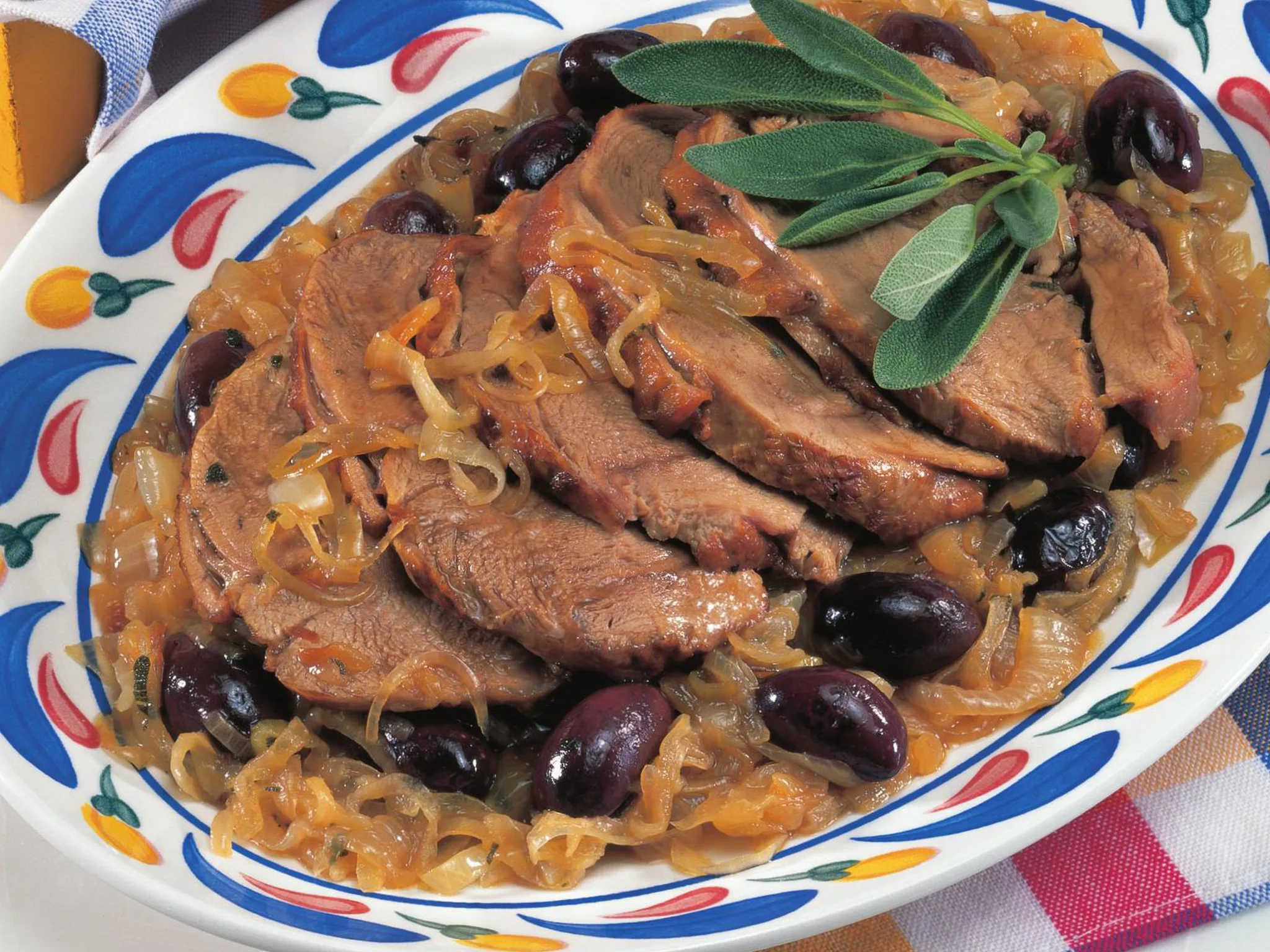 veal and prosciutto roll with caramelised onions