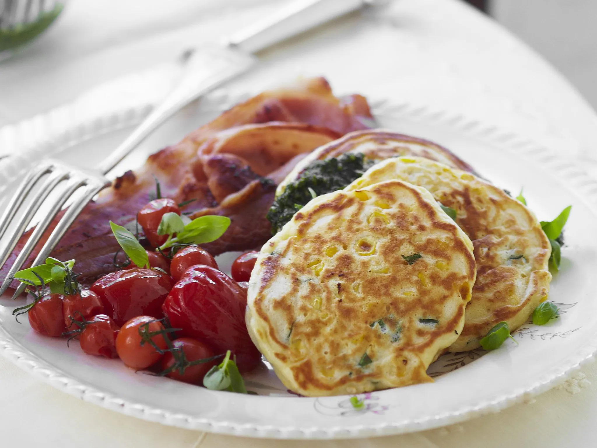 corn and ricotta cakes with pesto and crispy bacon