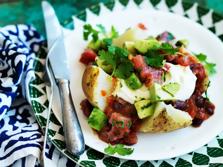 mexican stuffed potatoes with spiced tomato and avocado salsa