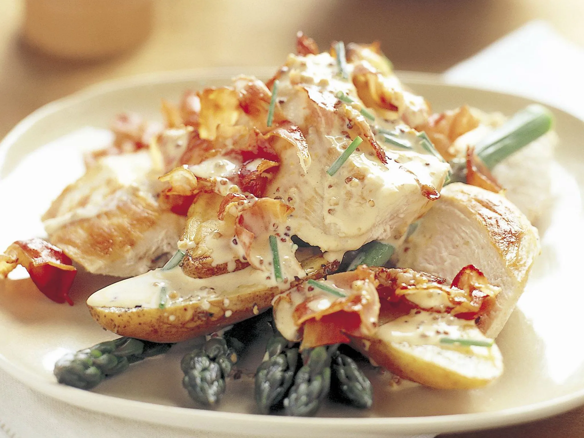 Chicken, asparagus and potatoes in garlic cream sauce