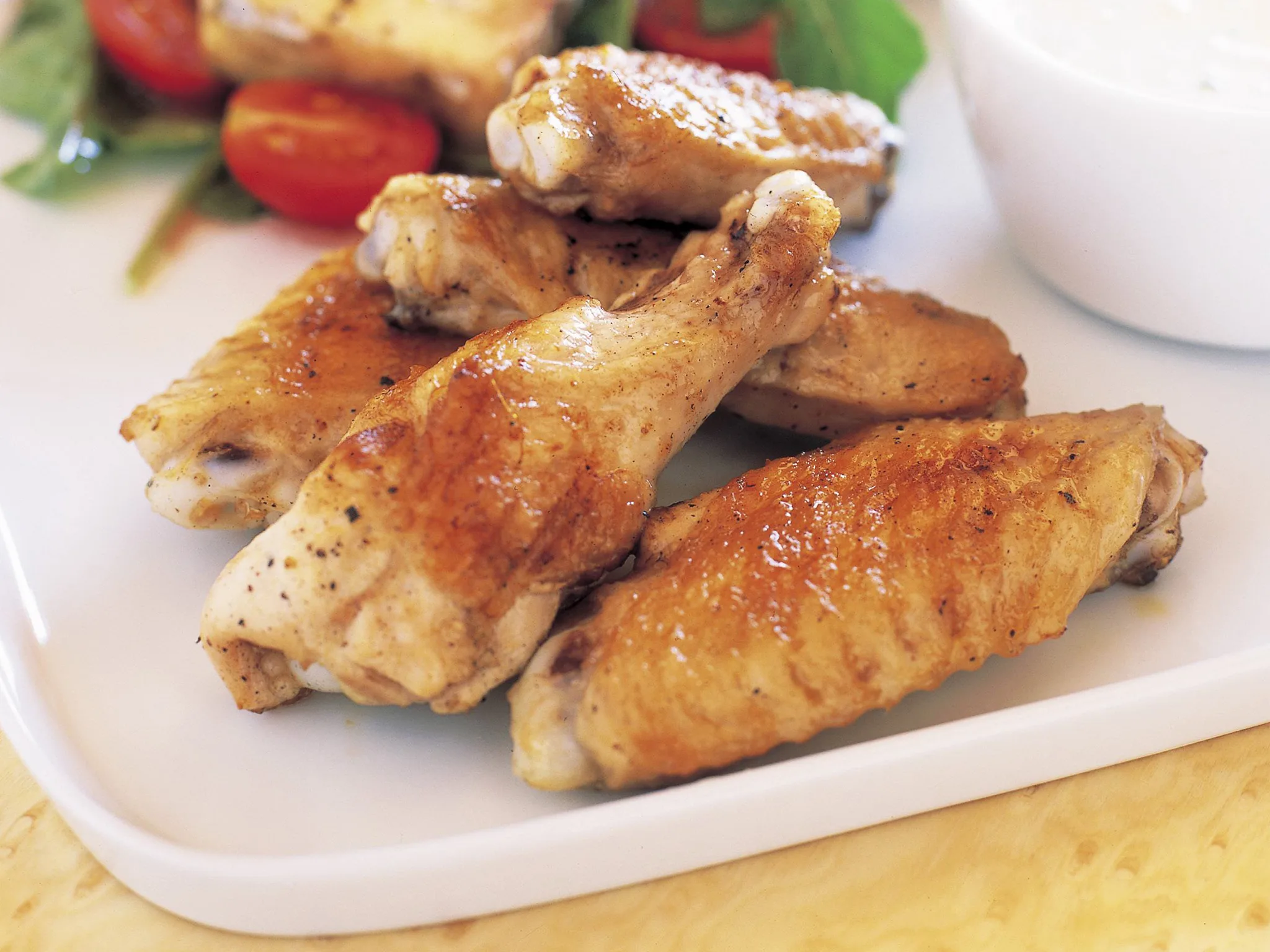 Grilled chicken wings with ranch dressing and rocket and blue cheese salad