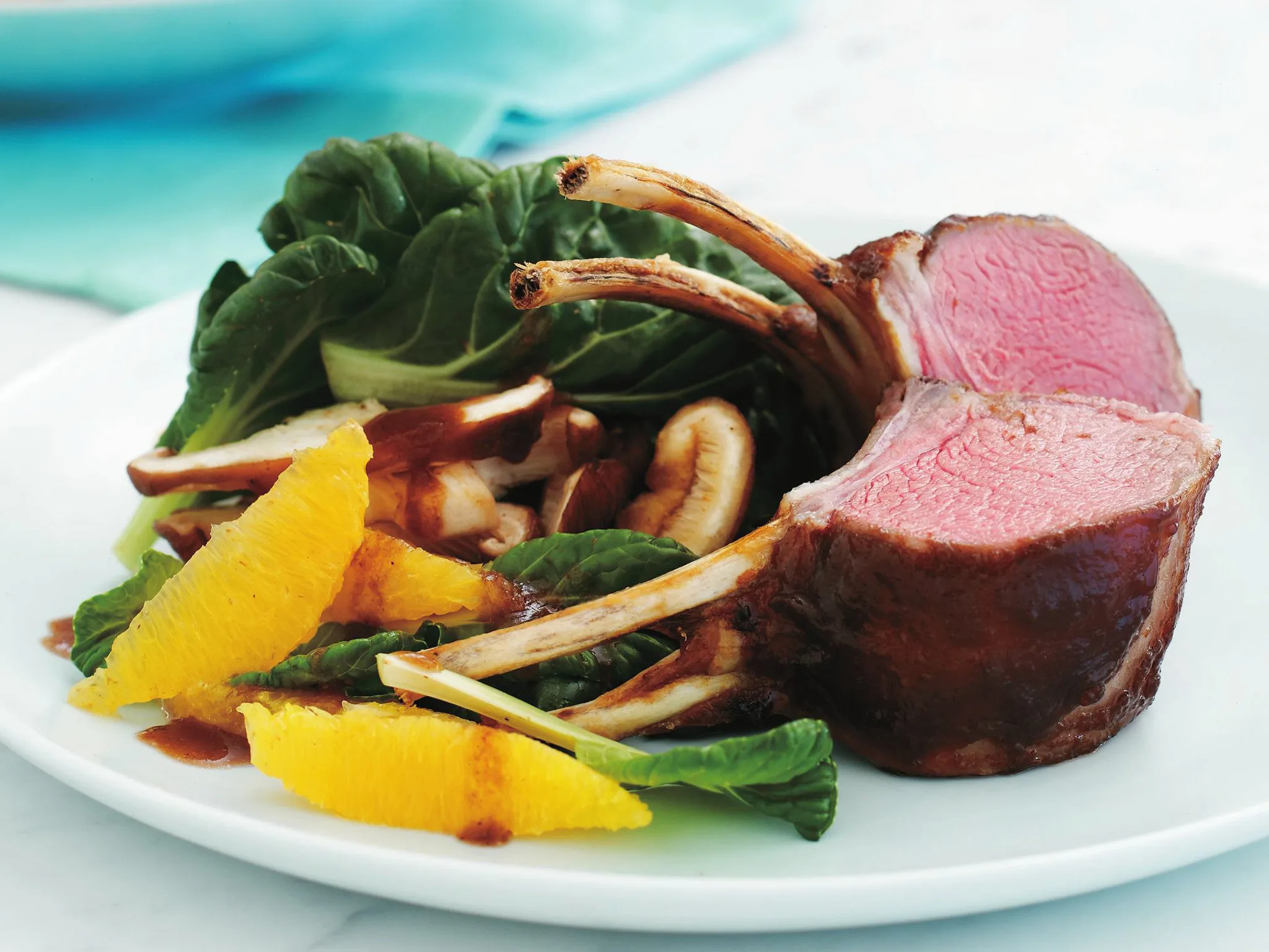 tamarind-glazed rack with tat soi and orange salad