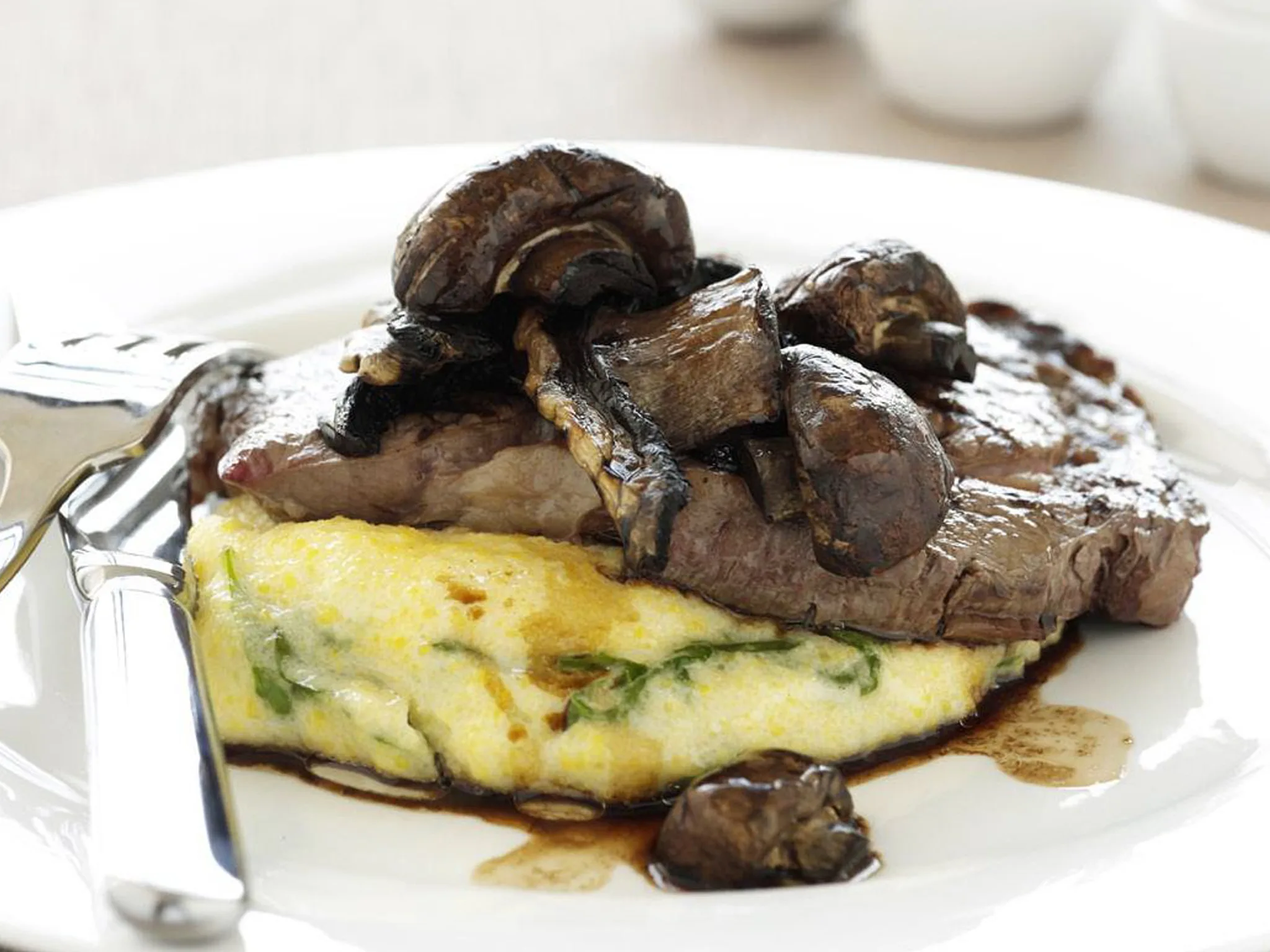 grilled mixed mushrooms and steak with creamy polenta