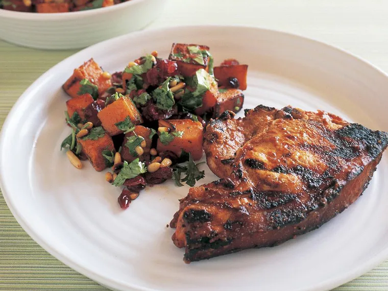 Pork chops with cranberry sauce and kumara craisin salad