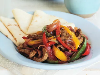 fajitas with guacamole and salsa cruda
