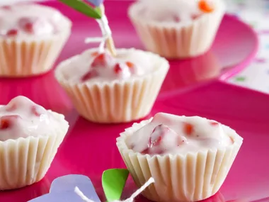 white chocolate cups with fruche and strawberries