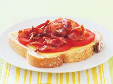 Cheese, tomato and bacon open sandwich