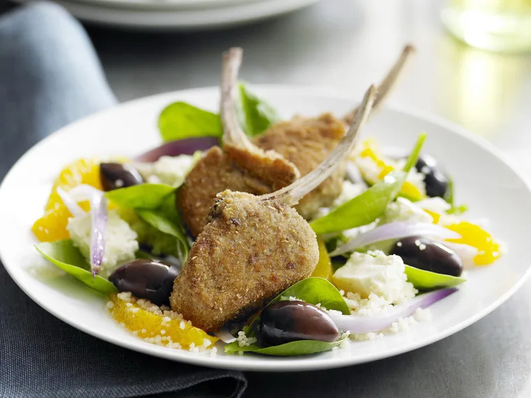 Crumbed lamb cutlets with orange, couscous and spinach salad