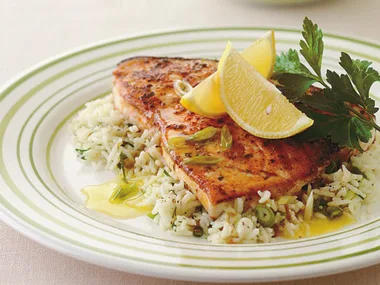 Cajun-style blackened fish with green rice