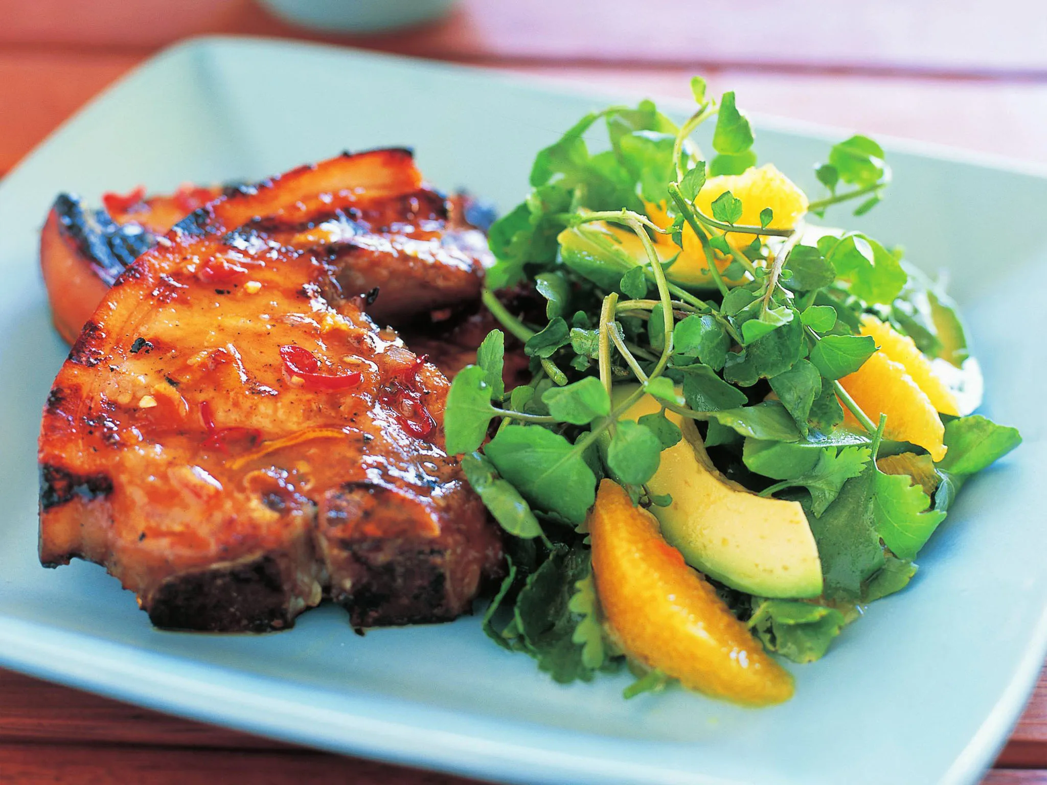 Margarita-marinated pork chops with orange and watercress salad