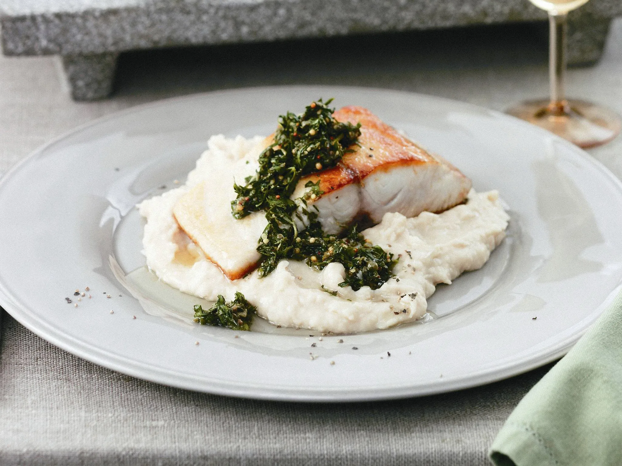 fish with green sauce and white bean puree
