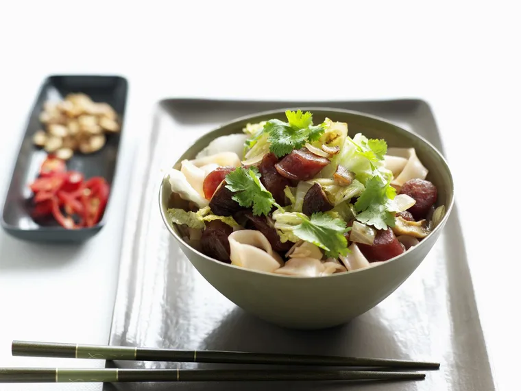 fried noodles with sausage and cabbage
