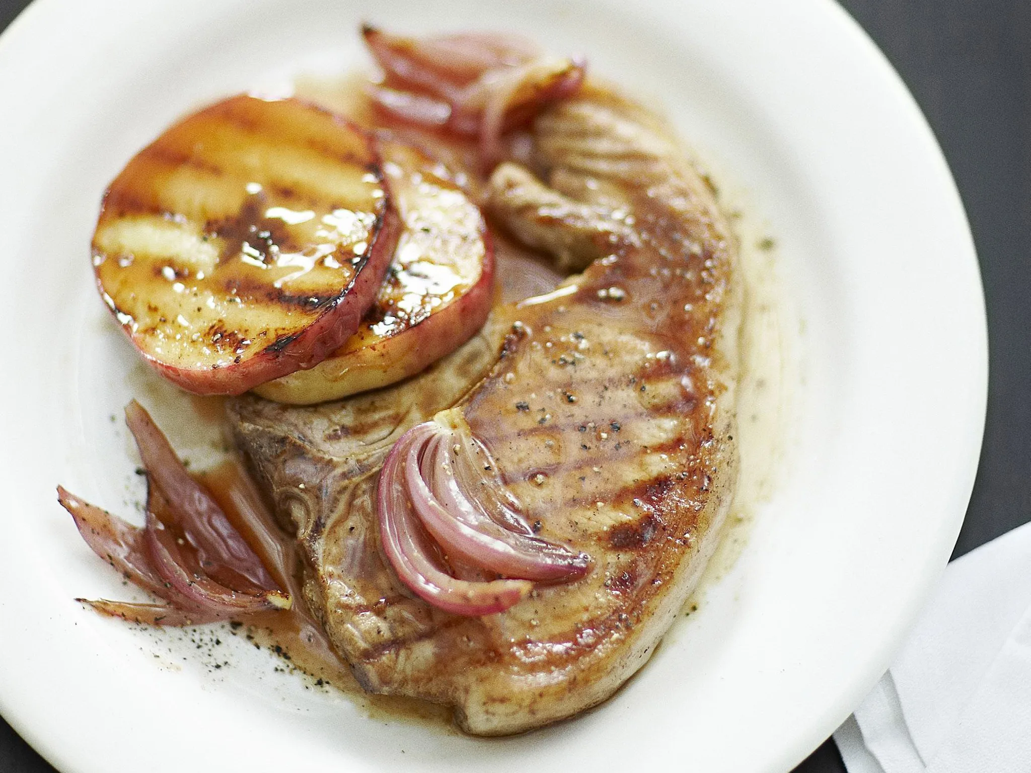 GRILLED PORK LOIN CHOPS WITH APPLE AND ONION PLUM SAUCE