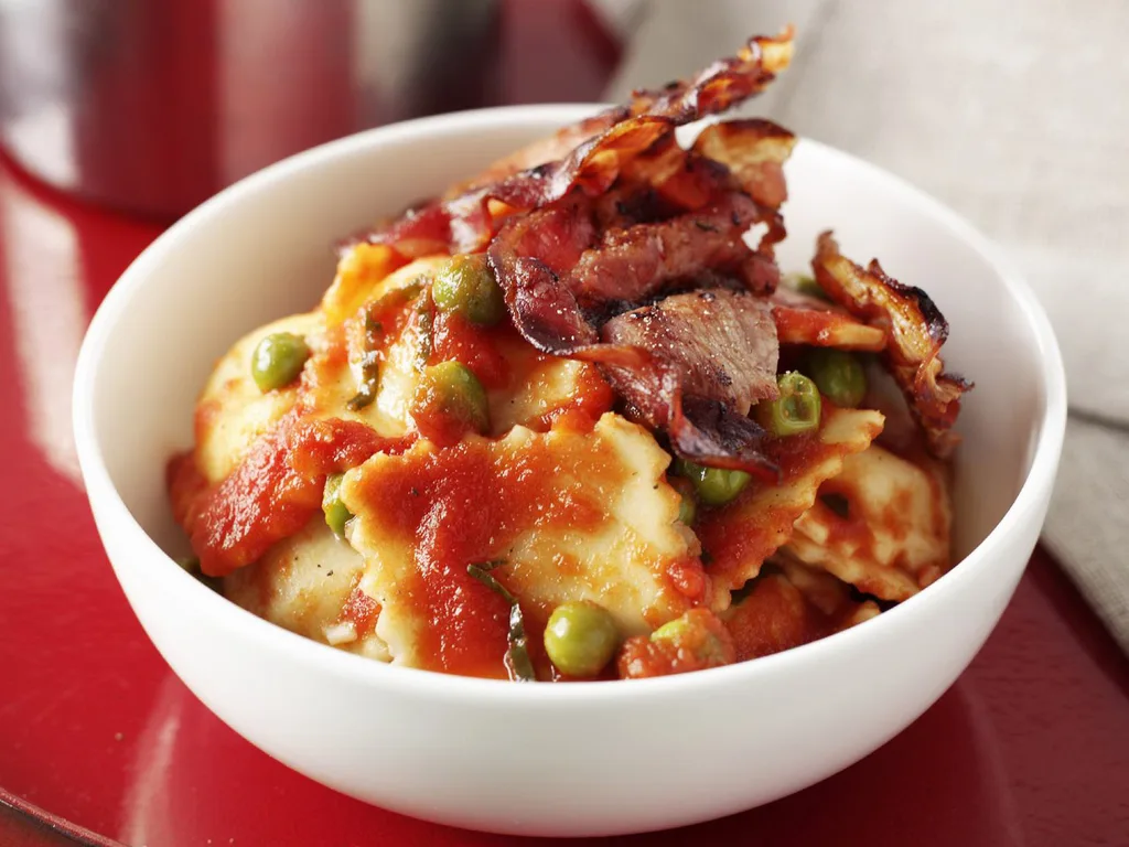 ravioli with tomato, pea and basil sauce