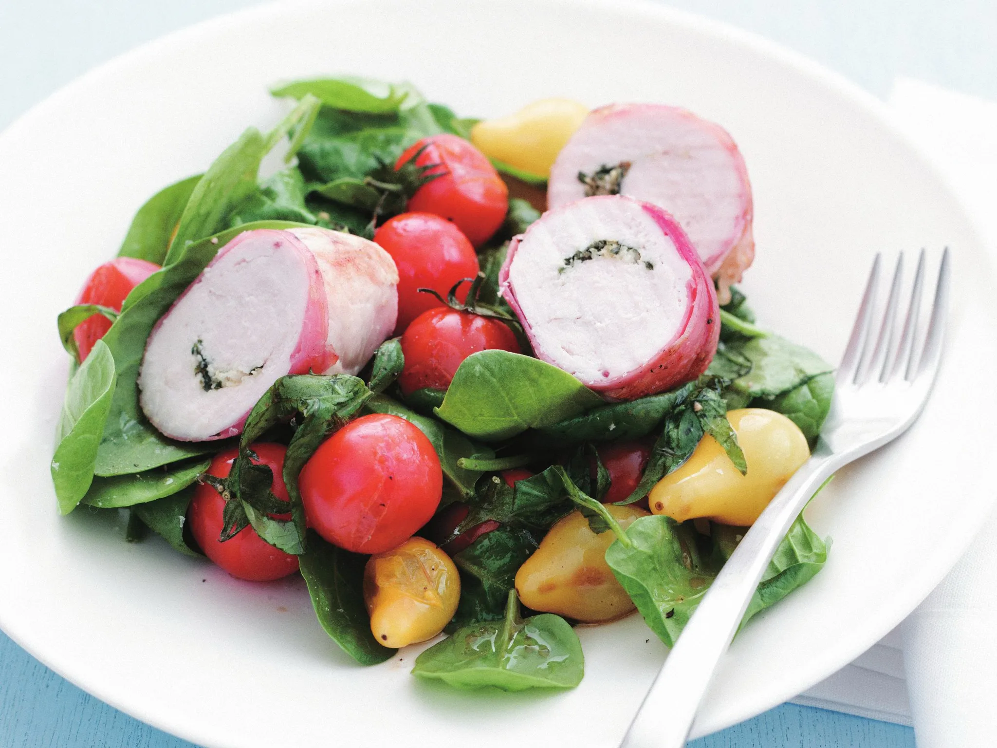 herb-stuffed chicken with tomato salad