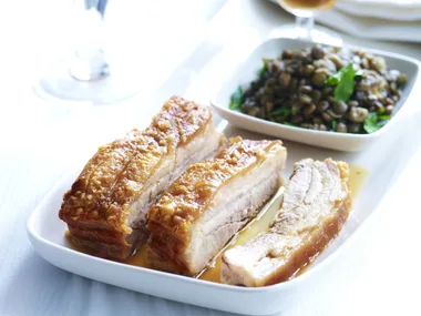 crisp-skinned pork belly with braised green lentils